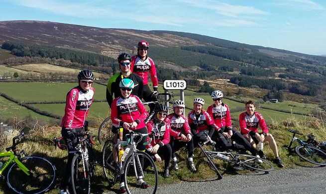 members of a Pulse group cycle pictured by the side of the road in the Wicklow Mountains.